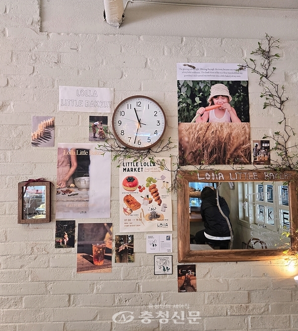롤라리틀베이커리 매장 내관, 거울과 시그니쳐 메뉴 일러스트 (사진=김해인 기자)